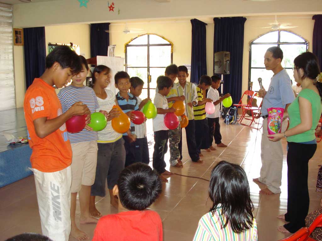 caring_orphan-Orphans are happy to play some games and make them enjoy and they know each other